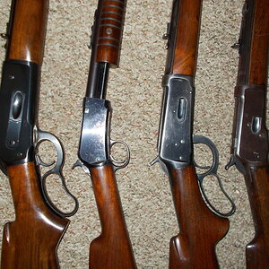 Four older Winchester rifles