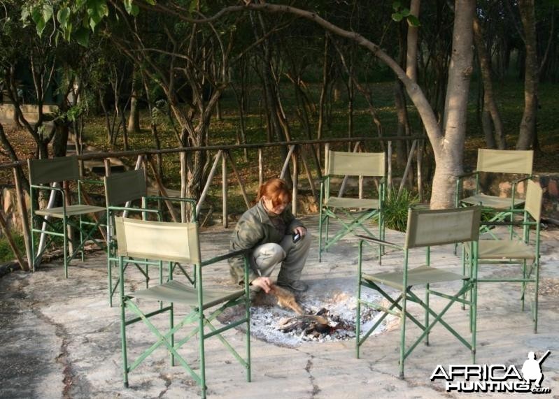 Stoking the Fire at Camp in Zimbabwe