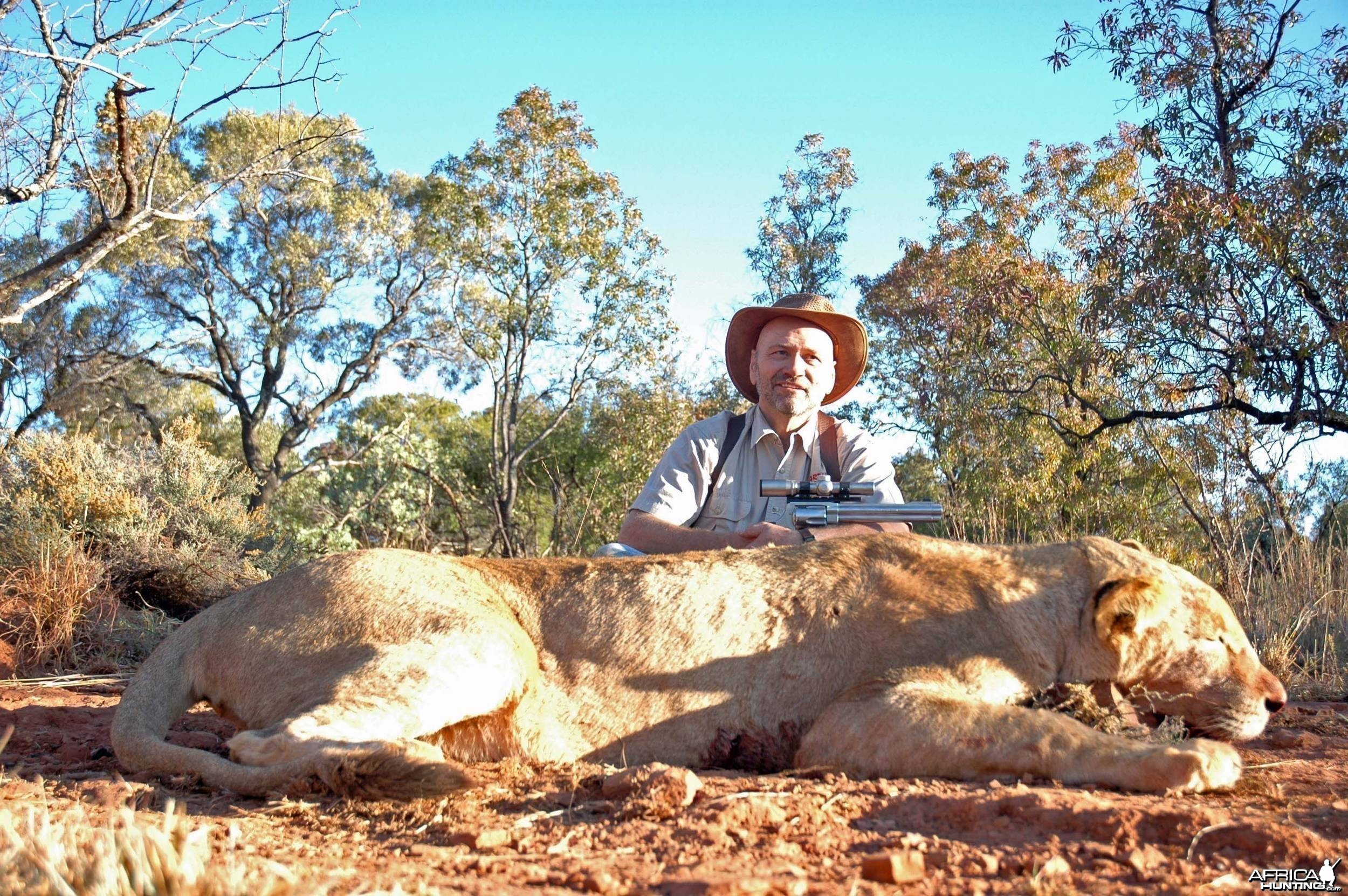 Lion with 500 S&amp;W revolver, took with Warthog Safaris