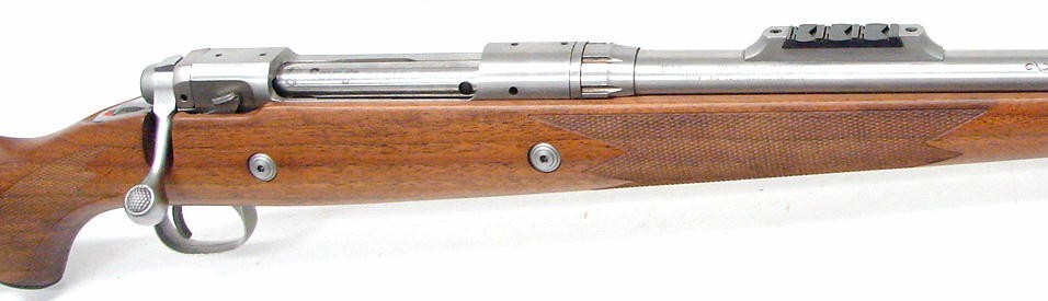 116-458-win-caliber-stainless-steel-safari-express-model-rifle-with-deluxe-checkered-walnut-st...jpg
