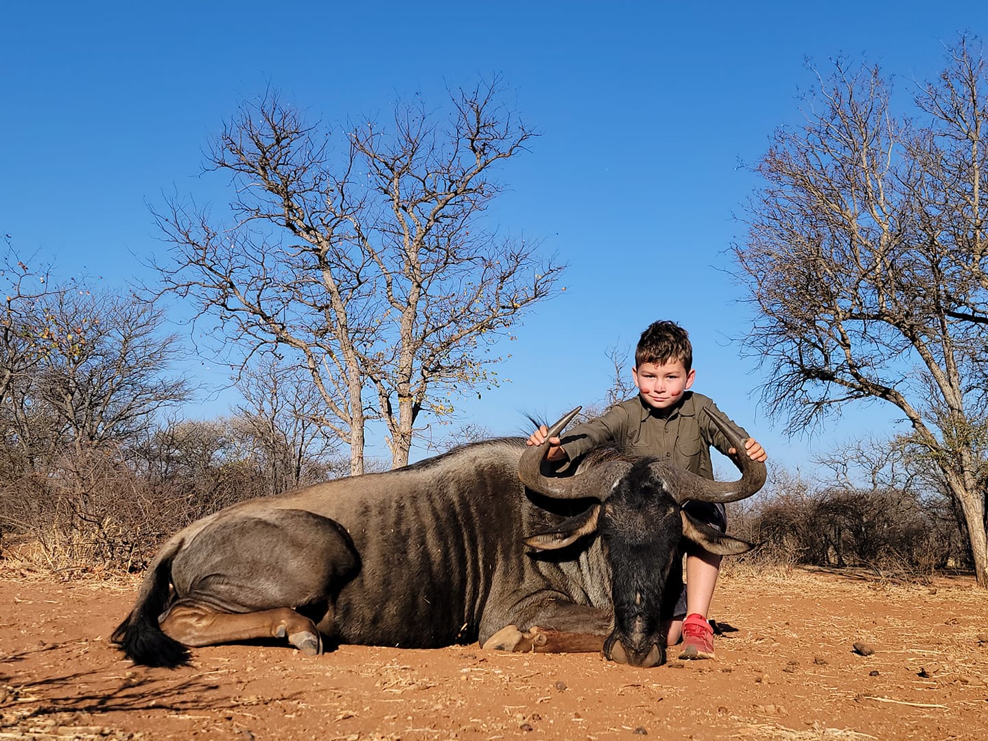 with myself his brother and the PH watching my son made a great shot , was down inside 50 yards