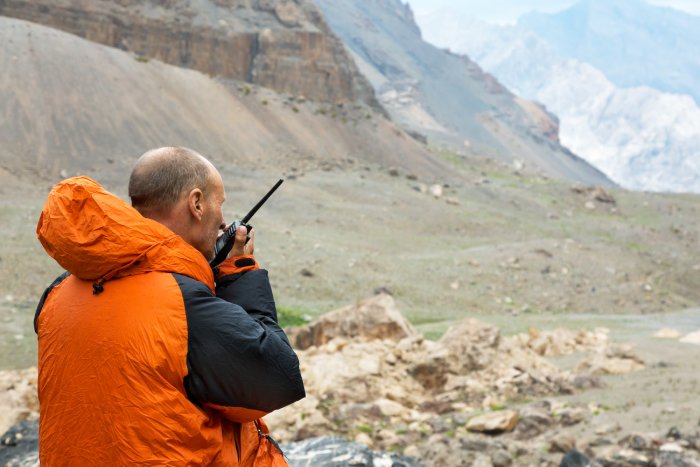 Orange-Jacket-Man-Sat-Phone.jpeg