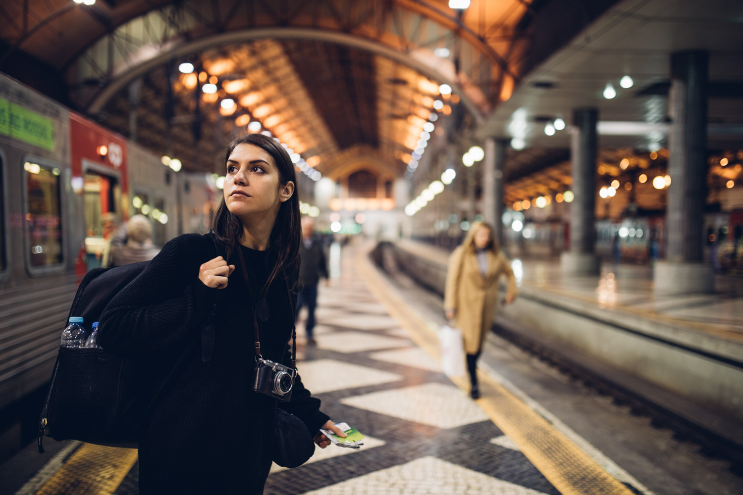 woman-on-train-platform-looking-over-her-shoulder.jpg