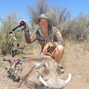 lady hunter and a fine warthog...