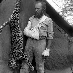 Biologist and the animal activist Karl Eykli poses with a leopard whom he killed naked 1896 Africa