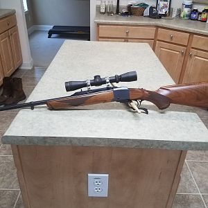 Ruger No1 7x57 Rifle with Leupold 2-7×33 scope in stainless rings.