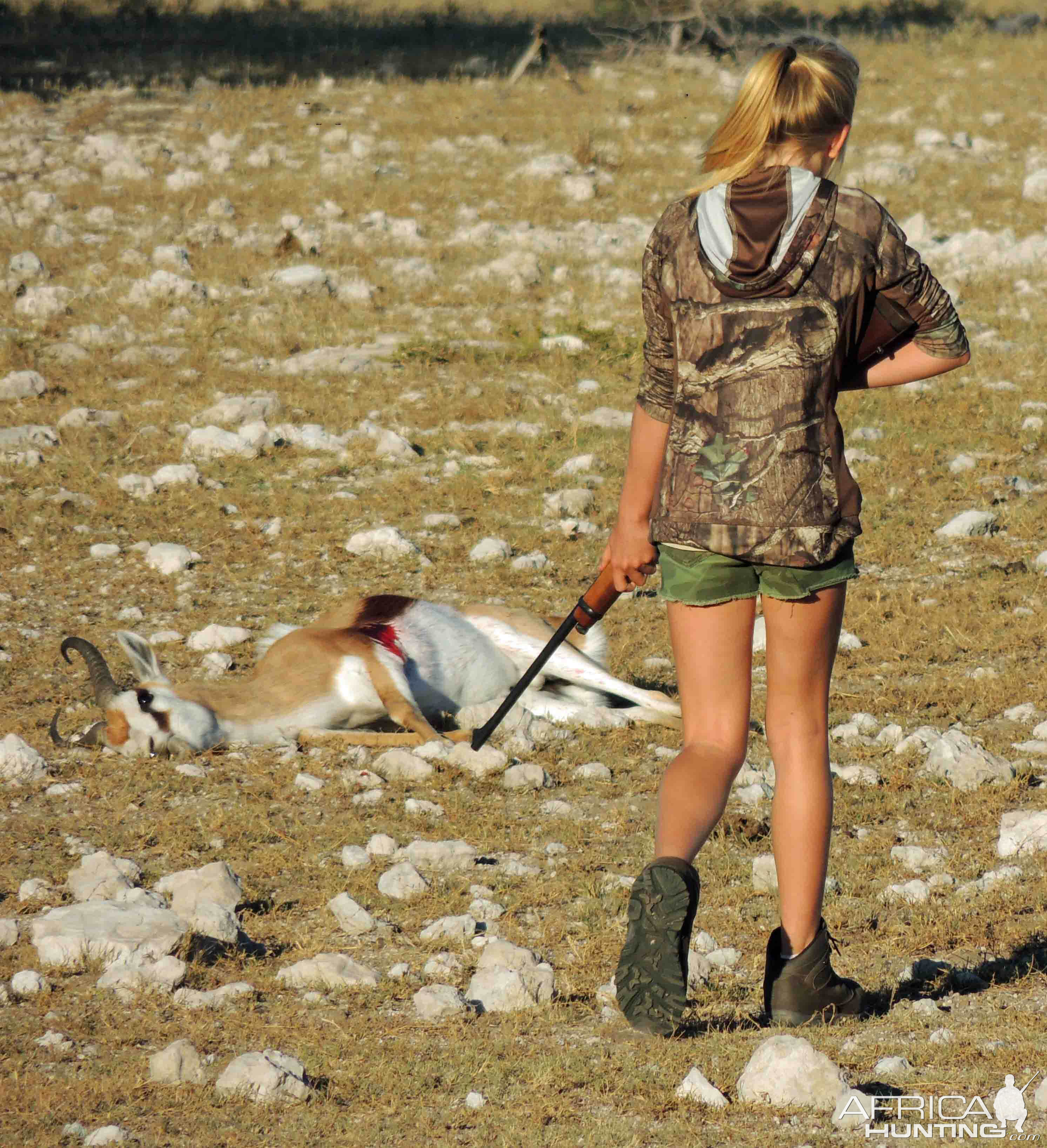 My daughter approaching the Springbok she had just taken at 160 meters. Perfect shot placement!