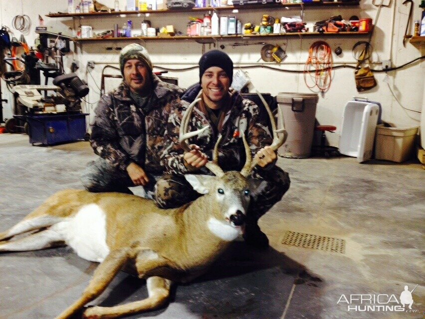 Proud papa with son's first big whitetail