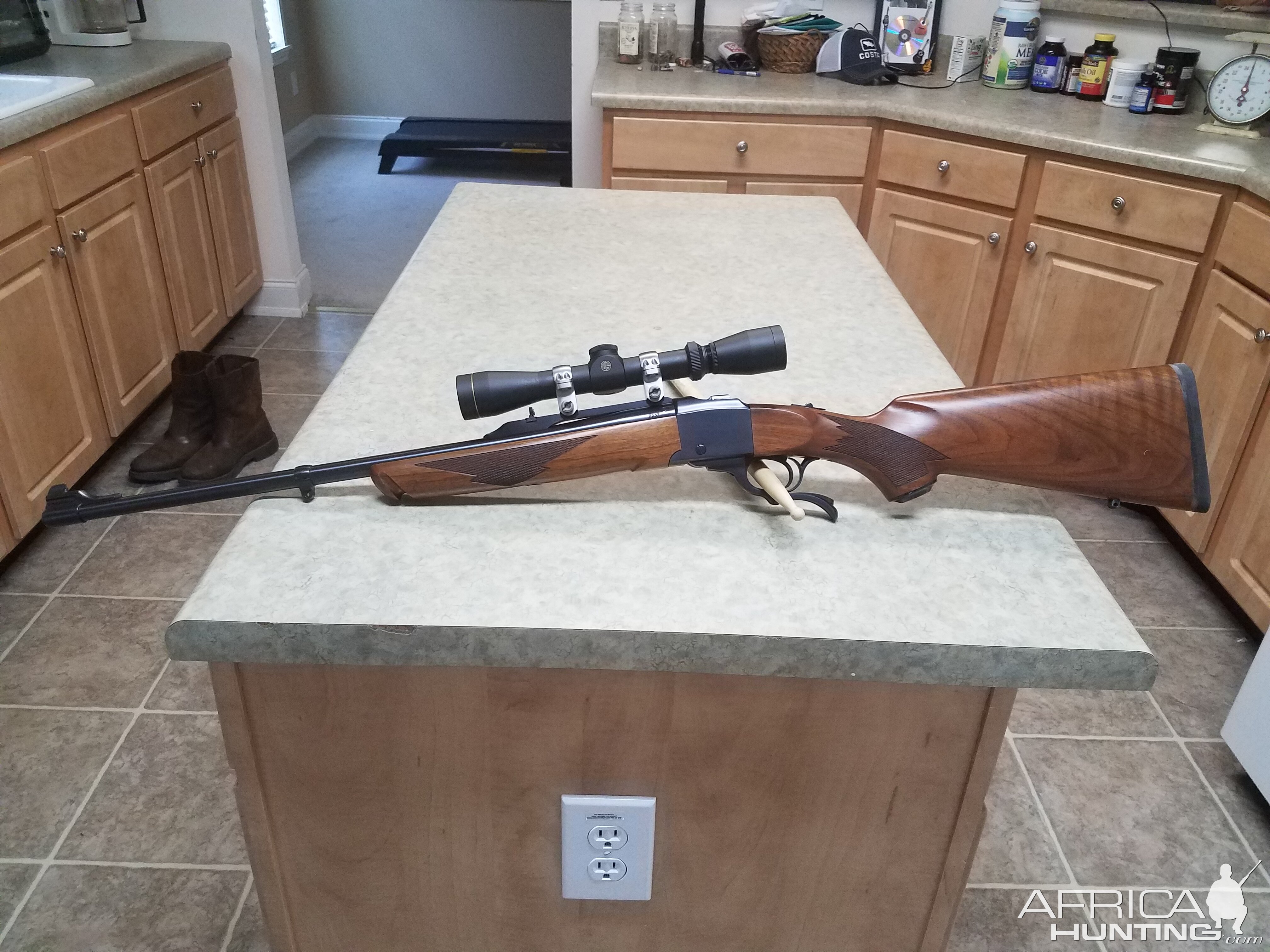Ruger No1 7x57 Rifle with Leupold 2-7×33 scope in stainless rings.