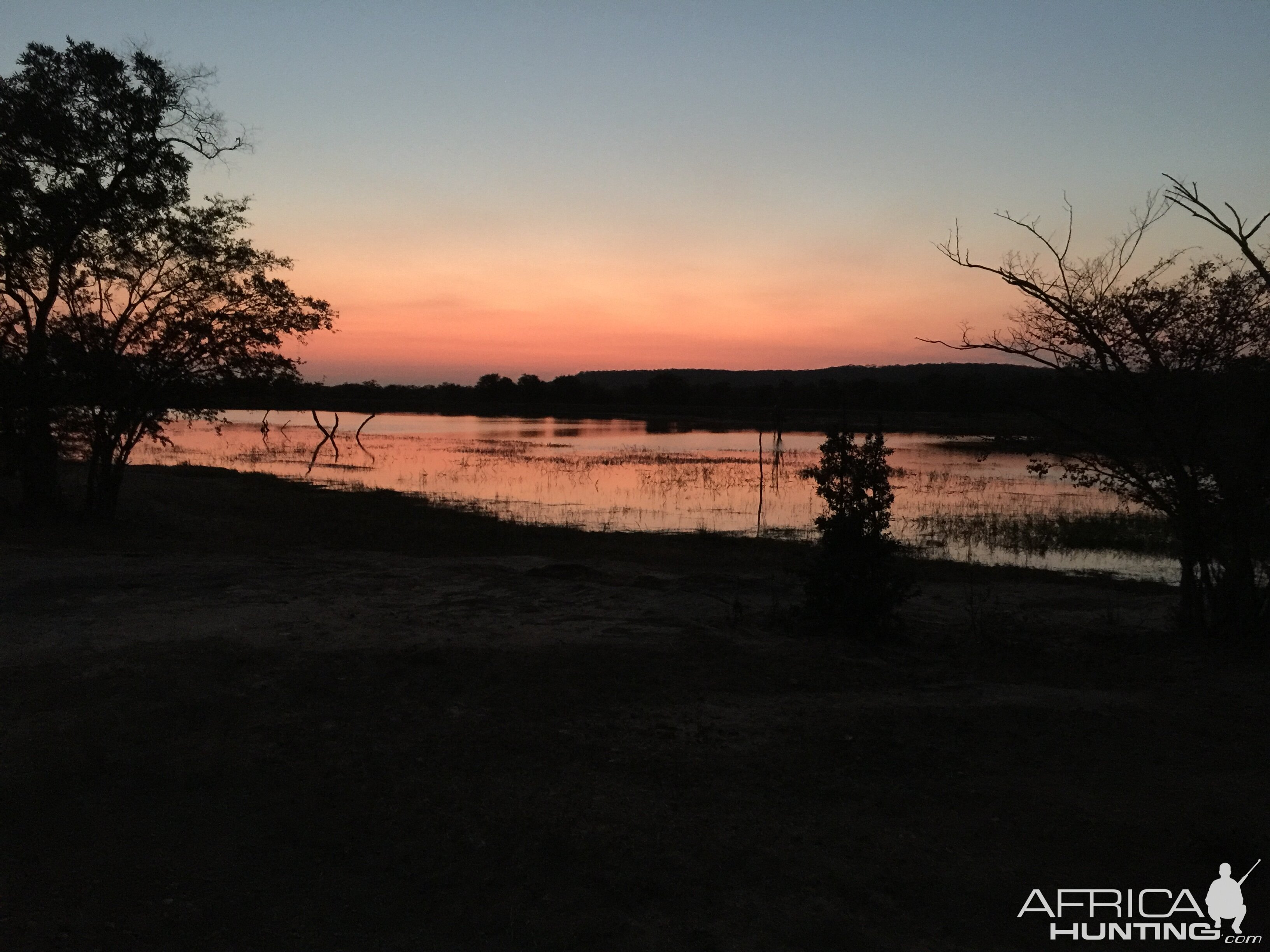 Sunrise over the reservoir at Hankano Ranch near the Gwayi River Zimbabwe